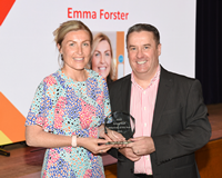 Active Schools Sports Development Volunteer Awards 2023. Councillor Tommy McVey presenting a trophy to winner Emma Forster.